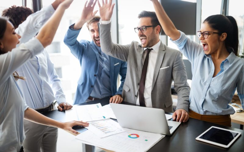business-team-celebrating-a-good-job-in-the-Y3VZMNL-scaled-1-800x500